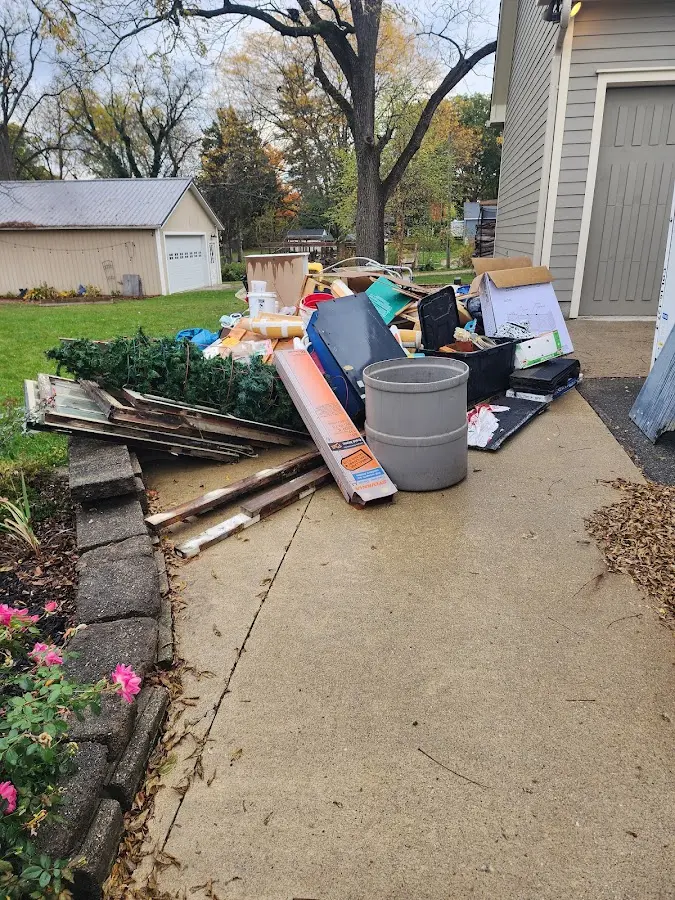 Dumpster being loaded with debris for Roofing Dumpster Rental in Santa Fe Springs